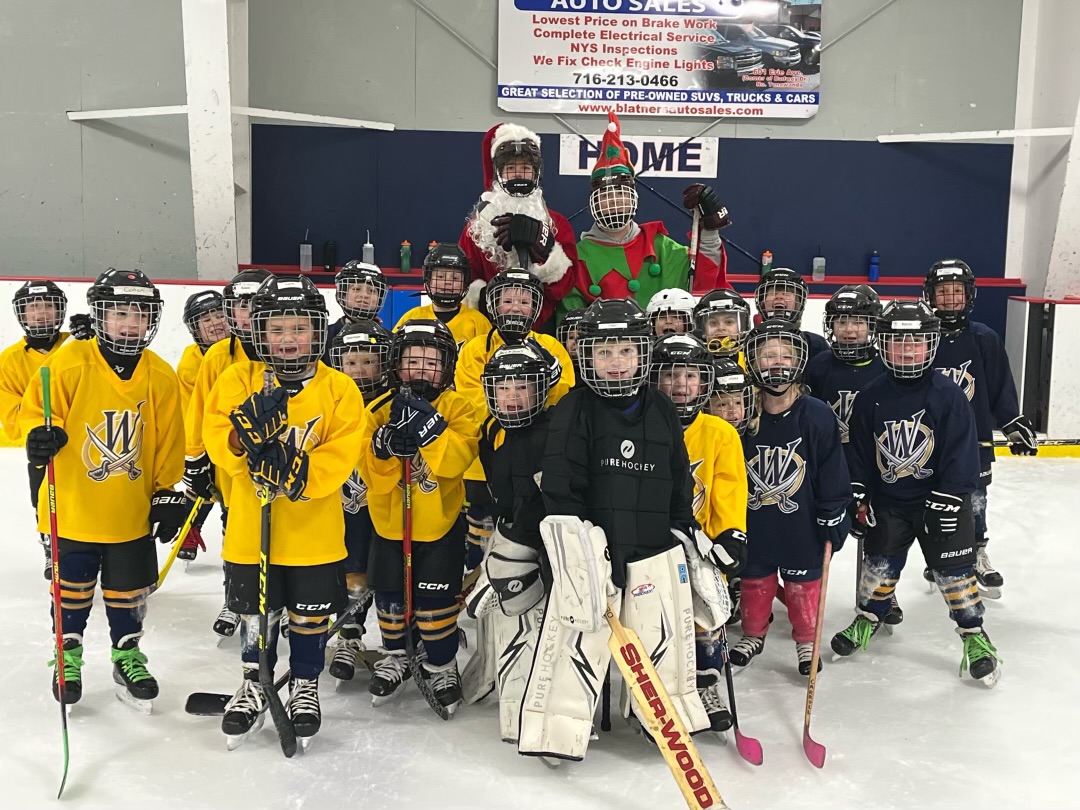 Santa and his Elf visit Mites and Novice! Wheatfield Blades Hockey